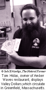 Tom Hidas displaying Valley Dollars