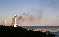 smoke billows from Fukushima No.1 NPP, 03-22-11 (AP)